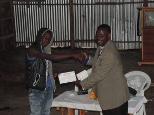 Shaker Brian receiving an Evangelism Course Certificate from Sowers International.
